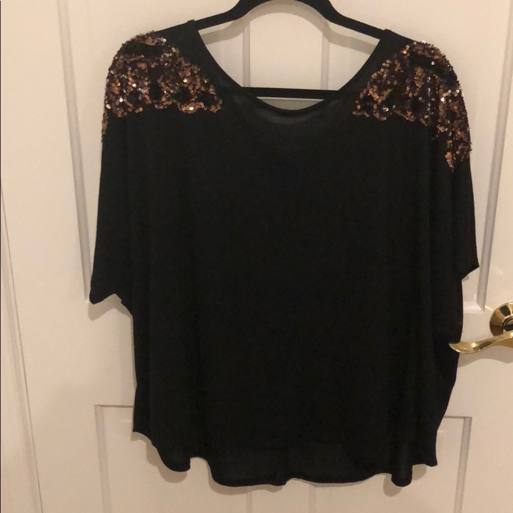 Black shirt with sequin butterfly on shoulders